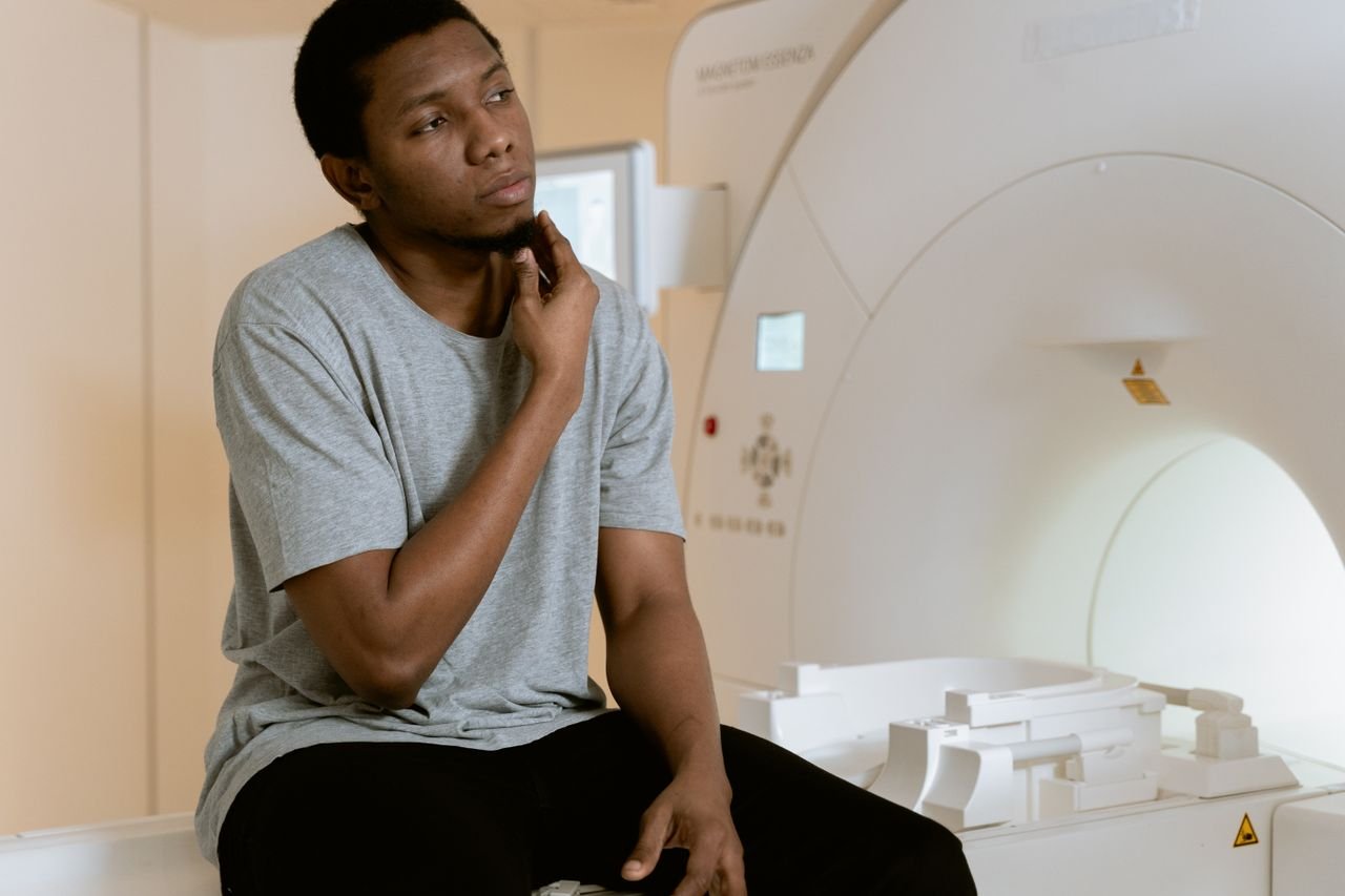 The Art of Drawing Readers In: Your attractive post title goes here A man sits nervously in an MRI scan room, contemplating his health diagnosis.